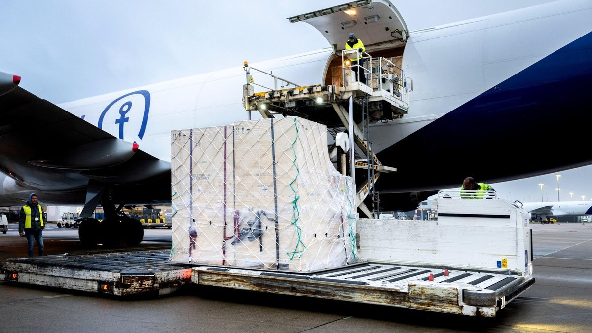 Palletised freight being loaded into an air-freight aircraft